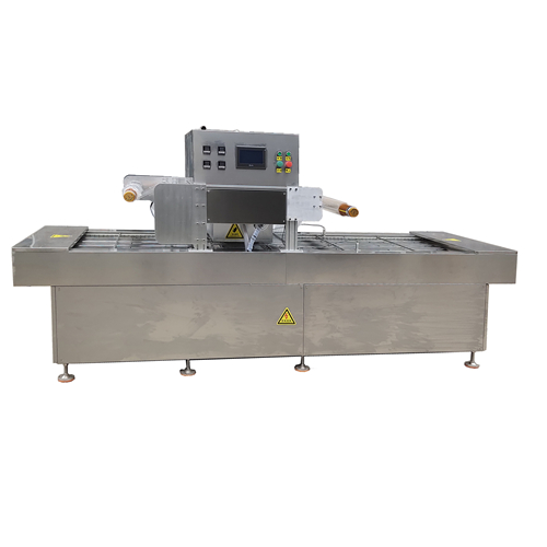 Continuous vacuum skin packing machine